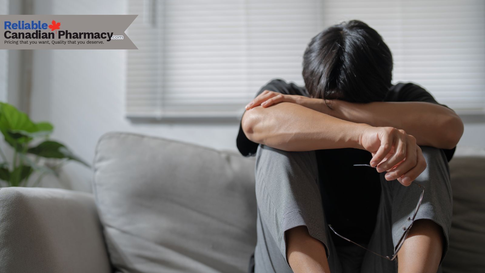 A man  with his head down, feeling depressed because of ED issues.