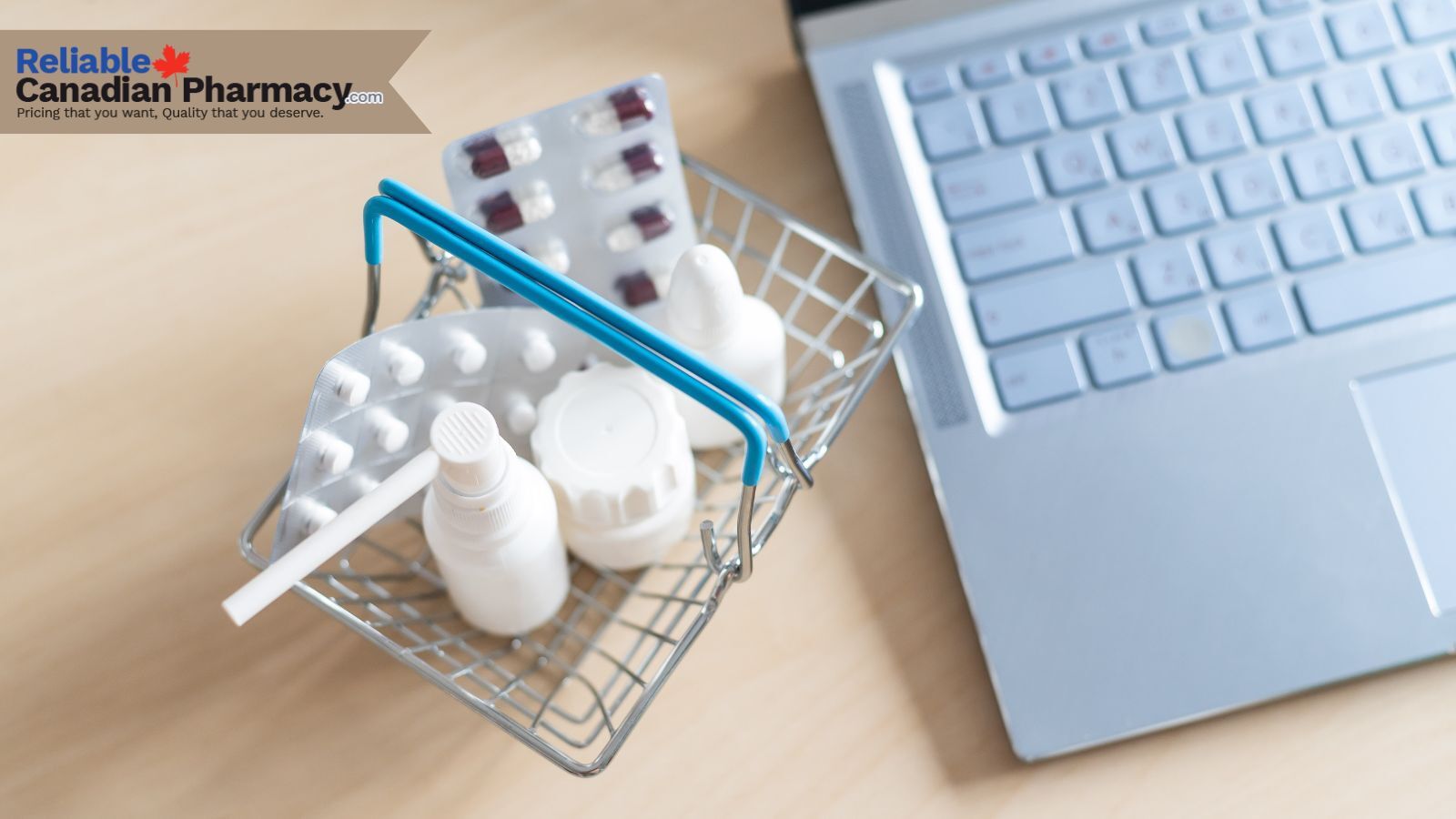 Strip of capsules, bottle of tablets and laptop to order medications online.